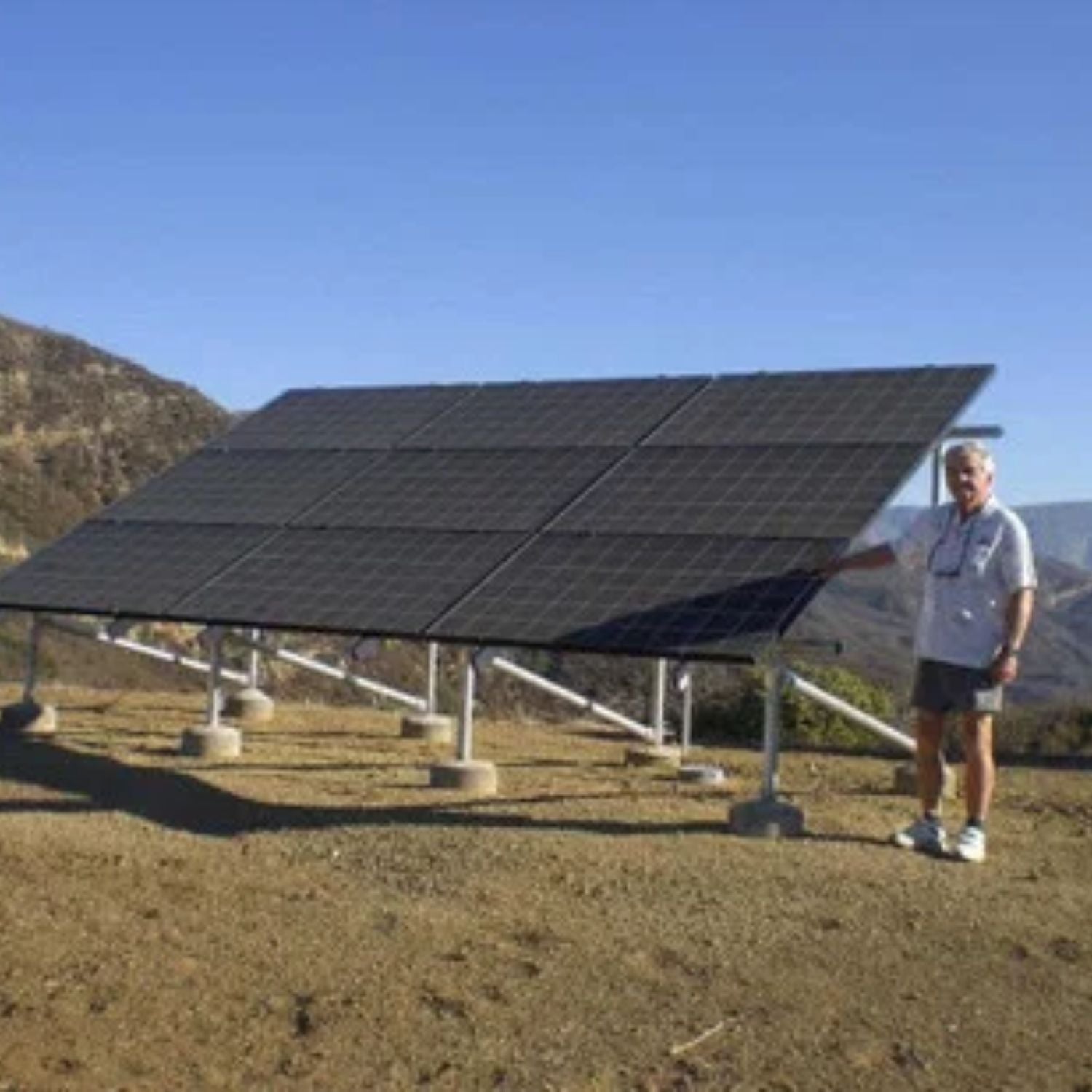 Tamarack Ground Mount Solar Racking Kit with a man aside 