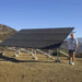 Tamarack Ground Mount Solar Racking Kit with a man aside 