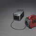 Two portable power stations, one Anker SOLIX C2000 Gen 2 Portable Power Station and one red, on a gray surface.
