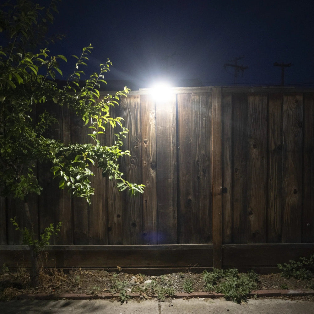 Wagan Tech 1000 Lumen Solar Wall Light On A Fence