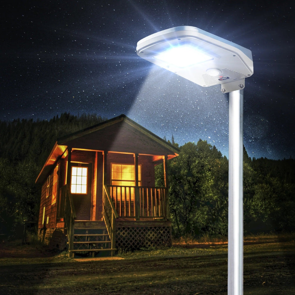Wagan Tech Solar + LED Floodlight 2000 On A Pole In front Of A House