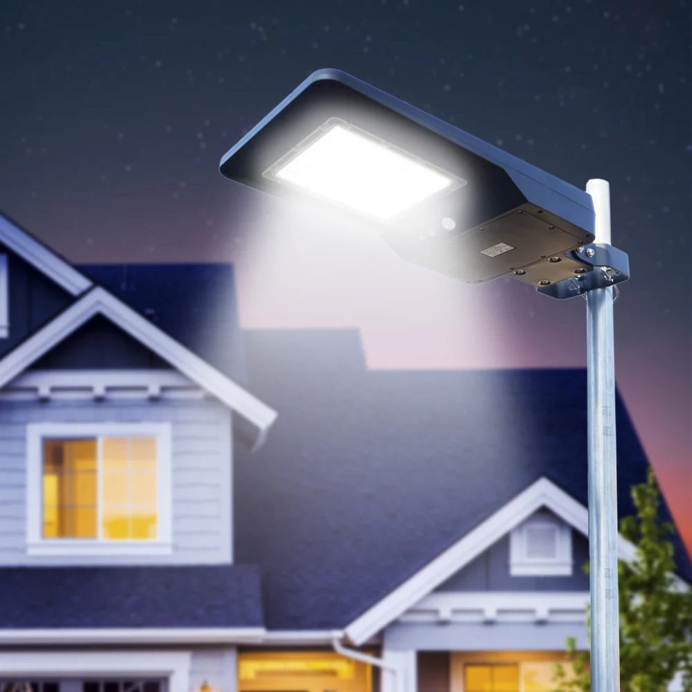 Wagan Tech Solar + LED Floodlight 4800 At Night In Front Of A House