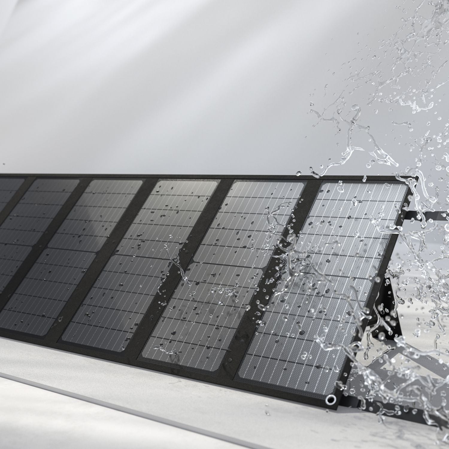 Water splashing on Arkpax 200W portable solar panel showing its water resistance
