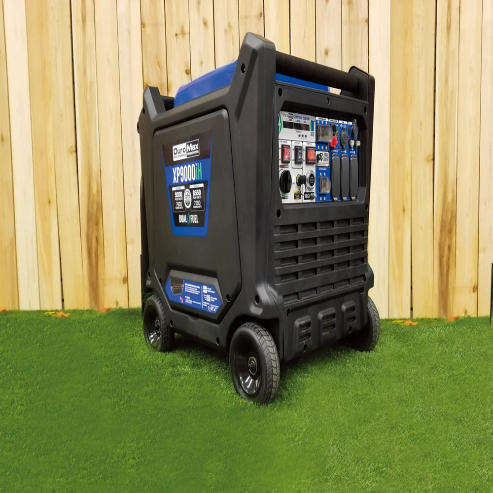 DuroMax XP9000iH Generator Outdoors On Grass Near A Wooden Fence
