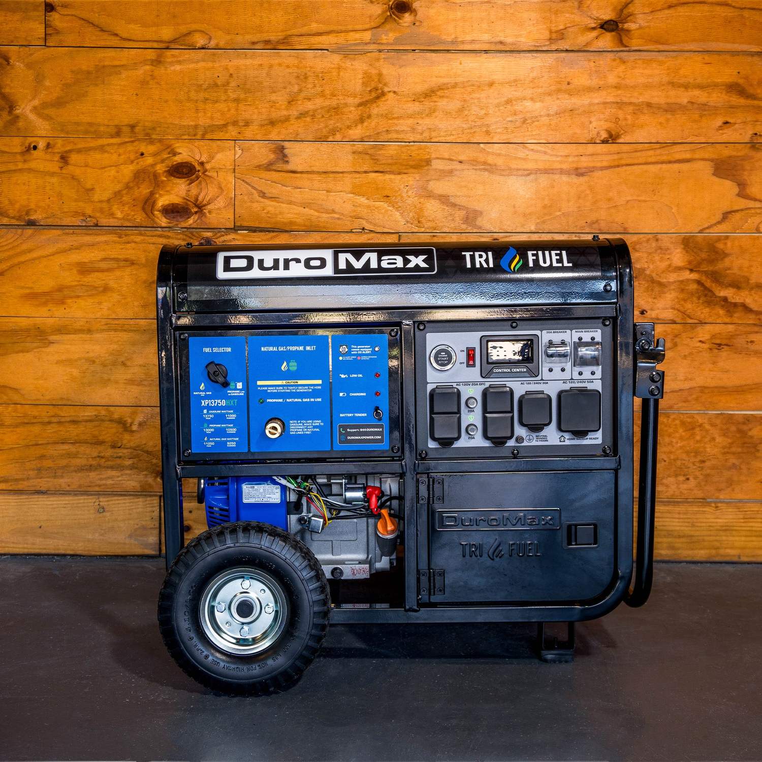 DuroMax XP13750HXT in front of a wood plank wall