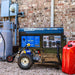 DuroMax XP13750HXT tri-fuel generator outside a brick house below the electric meter