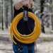 Man Holding a Firman Power Cord With Storage Strap